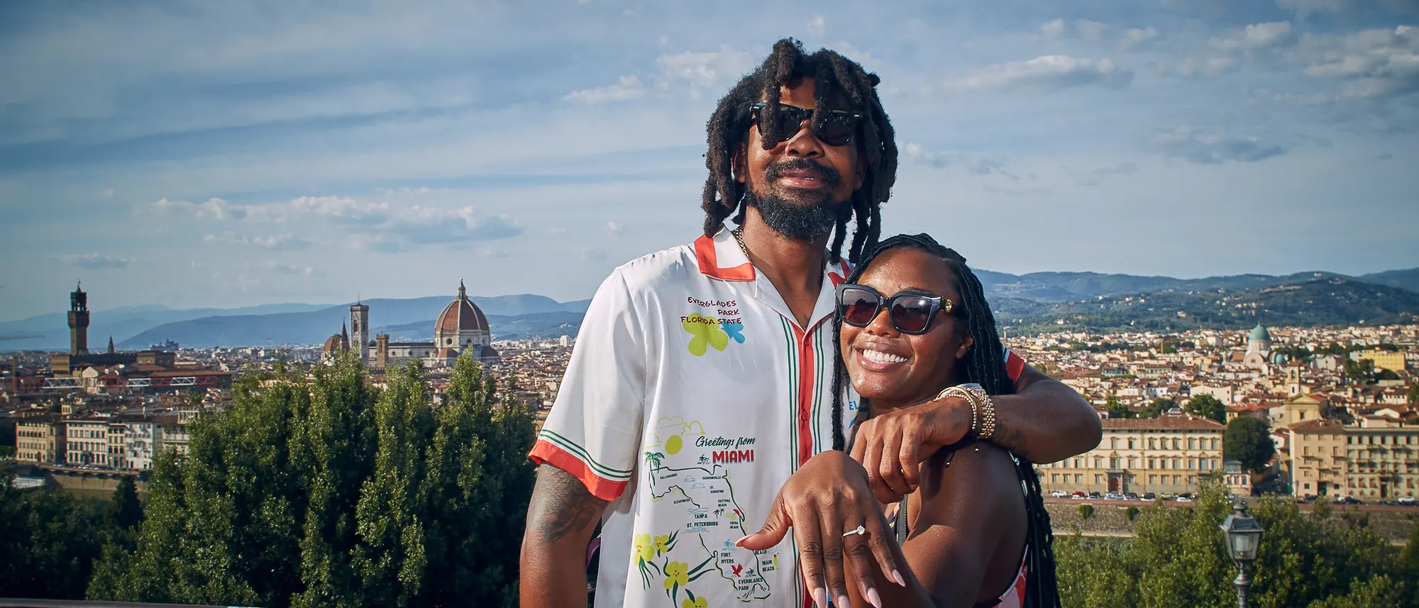 Happy couple enjoying a panoramic view of Florence from a scenic viewpoint
