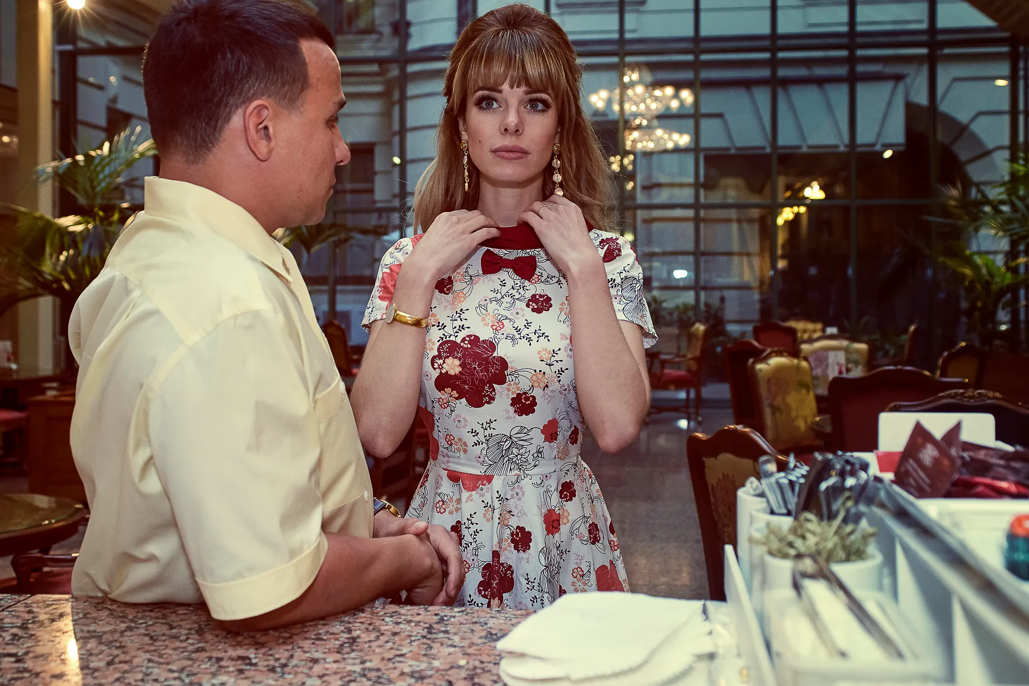 Fashion portrait photoshoot in a luxury hotel interior in Milan with elegant woman and stylist