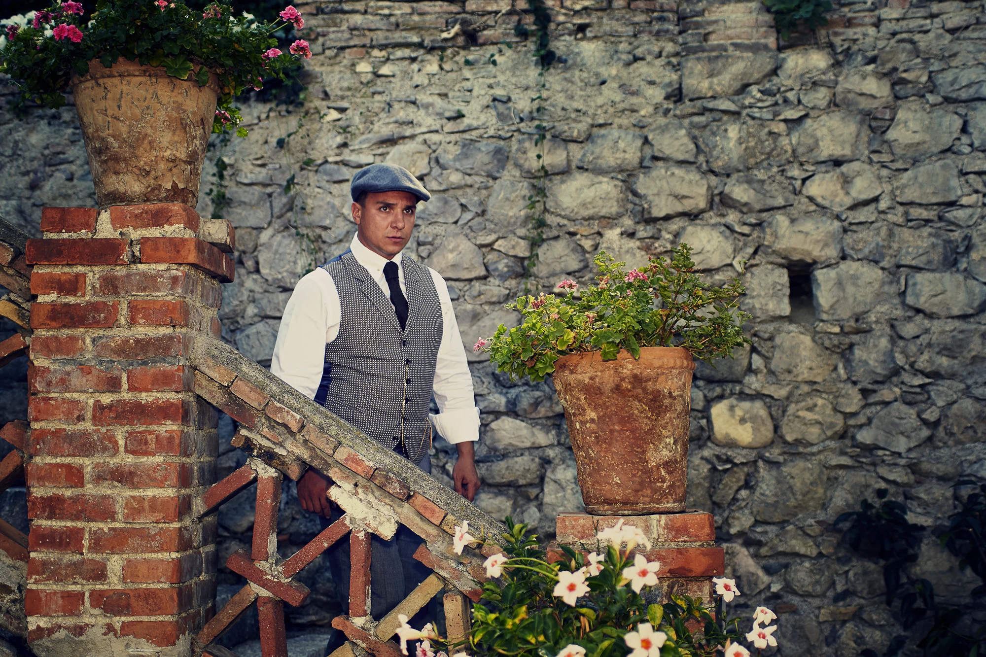 Vintage style male portrait in Italy photographed at a historic stone villa by a professional photographer (Pavel Manylov)