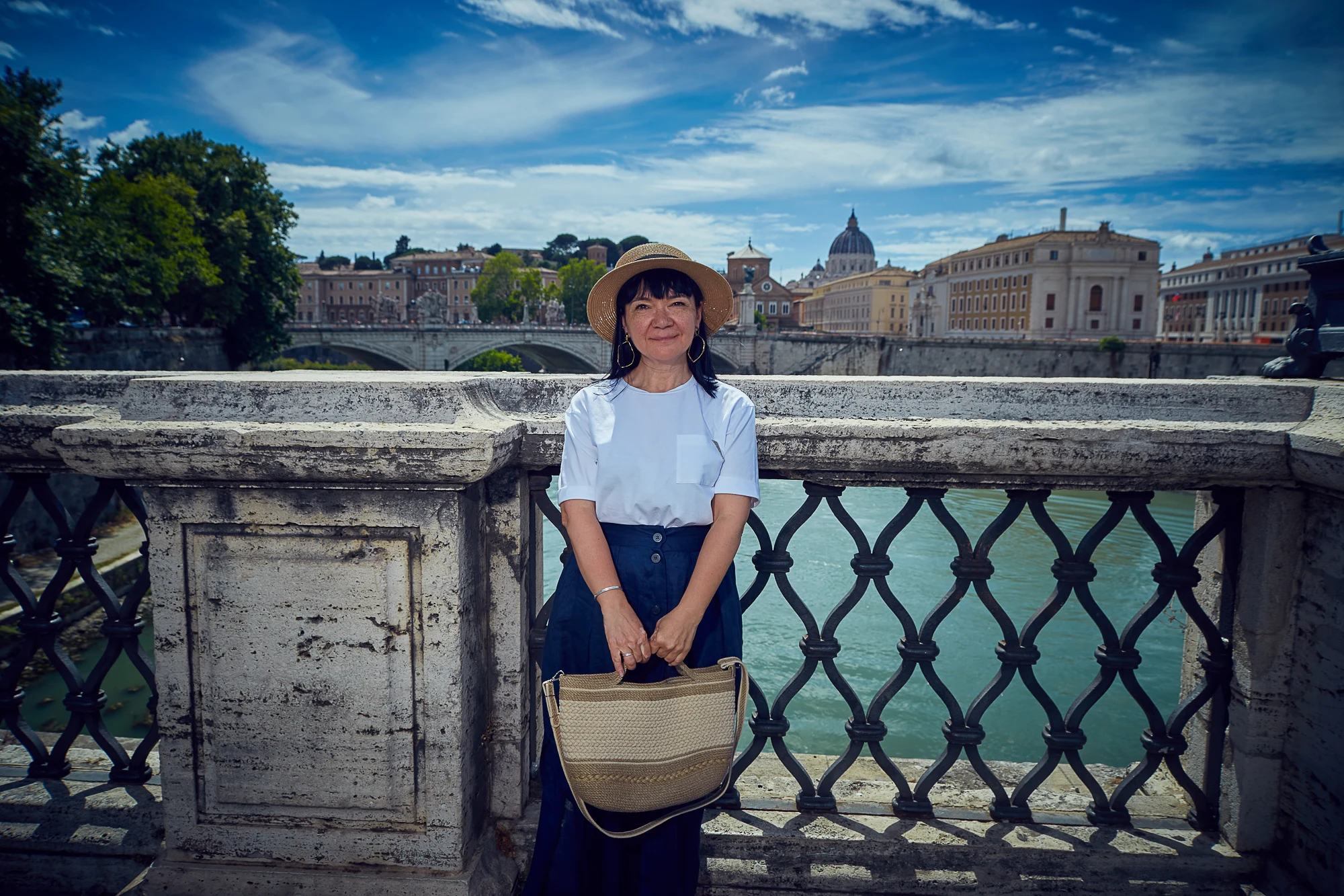 Woman portrait on a bridge with city view in the background