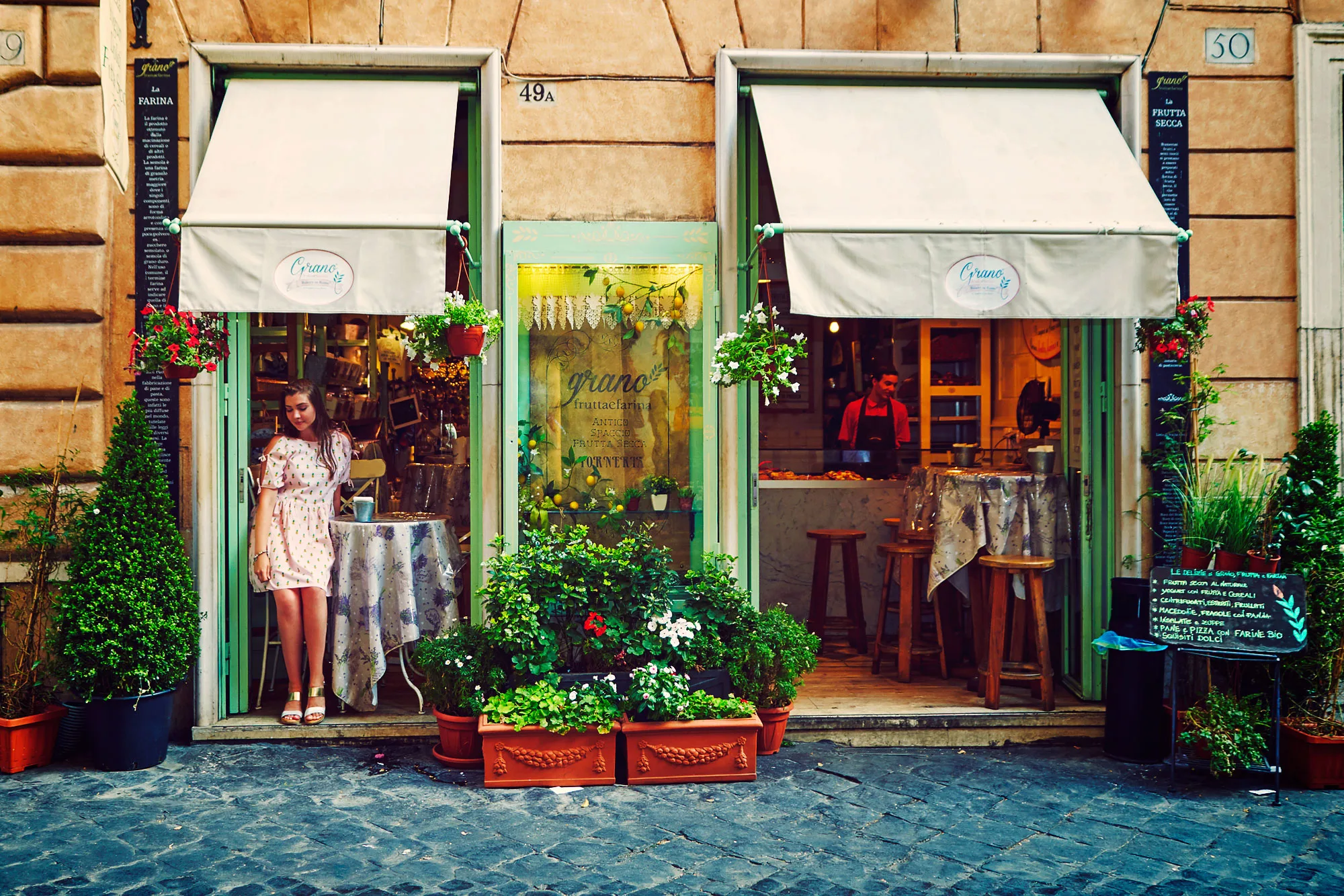 Lifestyle portrait of a woman in Rome with historic city architecture in the background