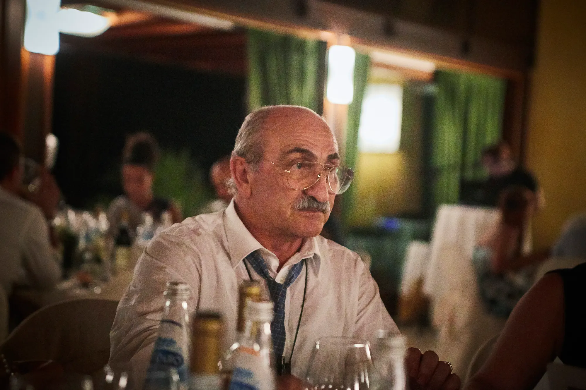 Wedding photographer in Italy documenting emotional guest portrait at reception