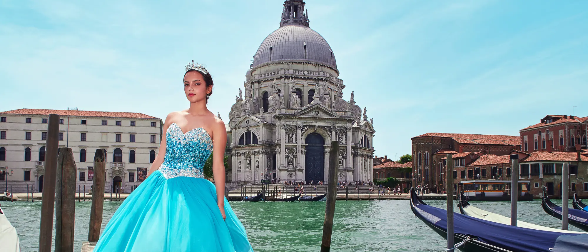 Young woman in blue ball gown posing by Santa Maria della Salute church, Venice photo shoot